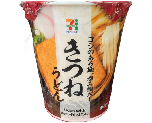 Cup of udon with deep-fried tofu from 7-Eleven, featuring Japanese text and brand logo.