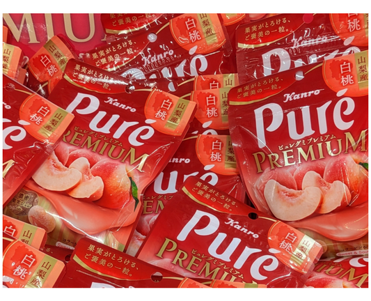 Red packaging of Kanro Pureé Premium peach gummies from Japan 